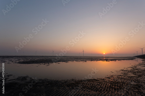 A wind farm on the coastline in the morning, Jiangsu, China
