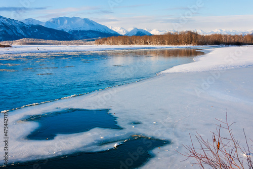 River and mountain covered with snow, Haines, Alaska, USA