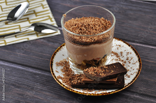 Muesli with chocolate on a dark wooden table. Healthy energy breakfast.