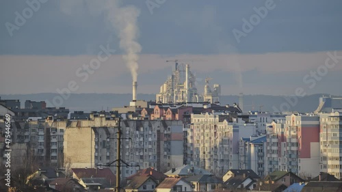 Wallpaper Mural Timelapse of cement plant with high factory structure and tower cranes at industrial production area near city urban area. Manufacture and global industry concept Torontodigital.ca