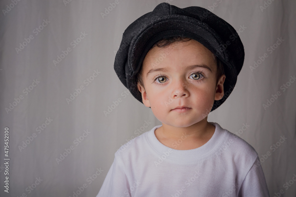 portrait of a little boy wearing an antique hat portrait of a little boy wearing an antique hat
