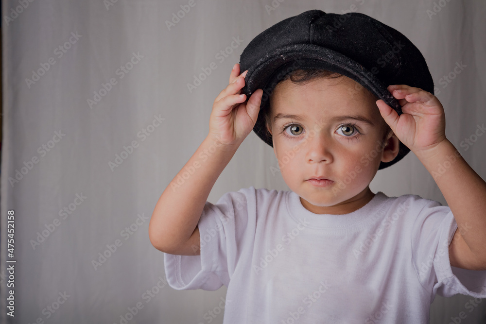 portrait of a little boy wearing an antique hat portrait of a little boy wearing an antique hat