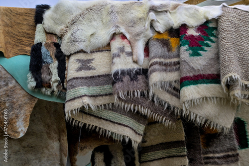 Ivano-Frankivsk oblast, Ukraine - Open Air Traditional Crafts Fair. Natural sheepskin fur and traditional Ukrainian patterns and designs made on woven products. photo