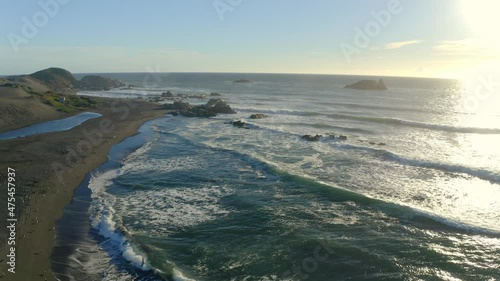 playa de matanzas Chile surf and wind kite surfing, drone shot on the sunset travel right, seagulls puertecillo topocalma pupuya photo