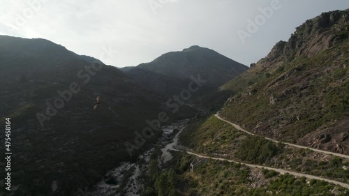 A touristic trail down the mountain valley shot at sundown in Peneda Geres National Park, Portugal. photo