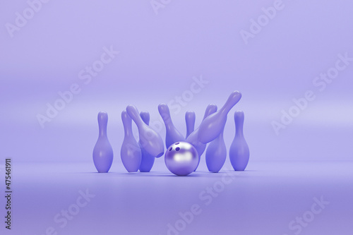 Slika na platnu Bowling ball and scattered purple skittles isolated on yellow background