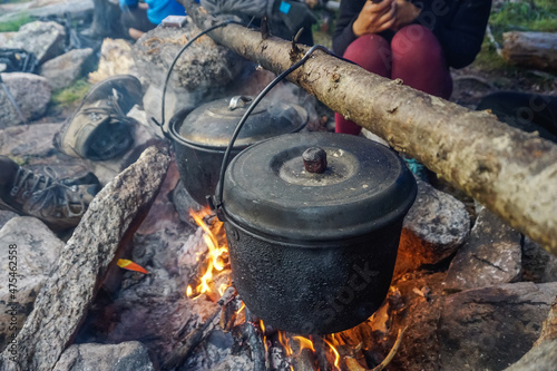 Cooking in a pot over a fire in the taiga