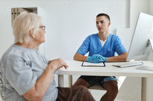 elderly woman patient is examined by a doctor professional consultation