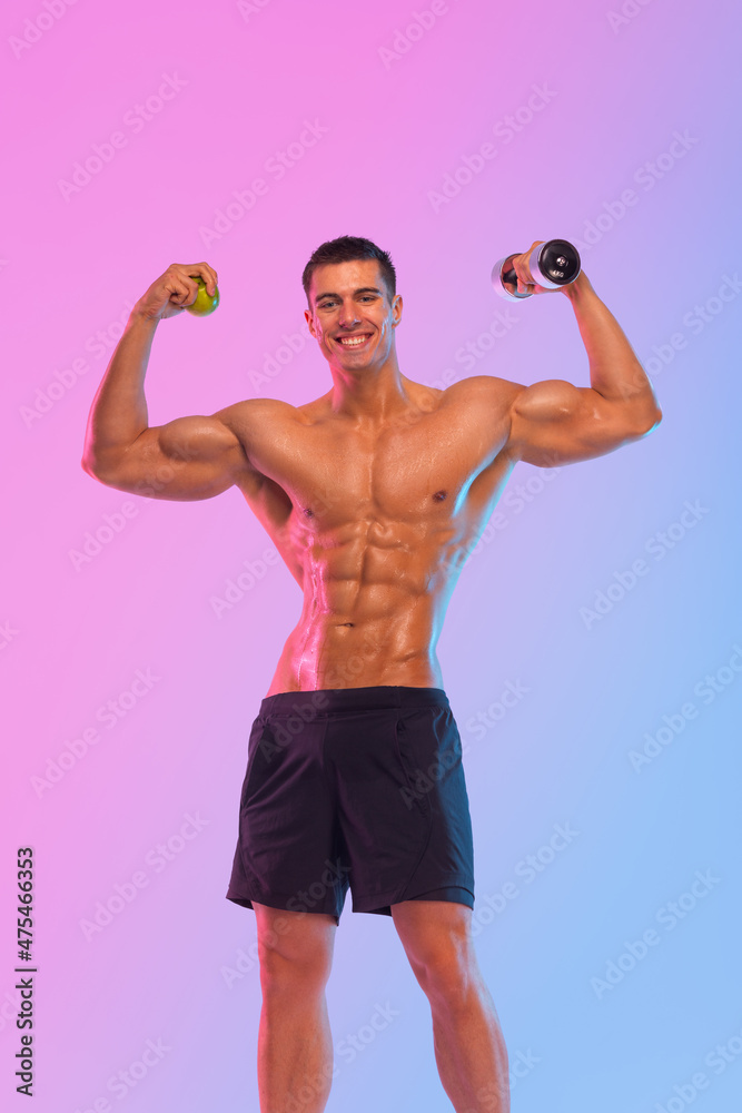 Happy man athlete with dumbbell isolated on pink background. Gym full body workout. Muscular man athlete in fitness gym have havy workout. Sports trainer on trainging. Fitness motivation.