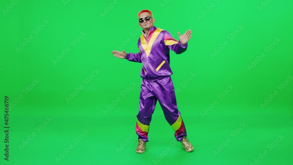 Pretentious retro guy in a purple suit dancing to the music on a green background, young digital influencer creates content, chromakey template, 4k slow motion. Pretentious retro guy in a purple suit dancing to the music on a green background, young digital influencer creates content, chromakey template, 4k slow motion.