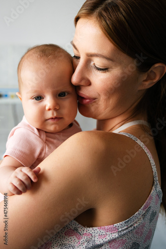 Portrait of a mother with her newborn baby