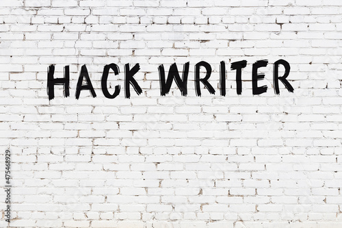 Inscription hack writer painted on white brick wall photo