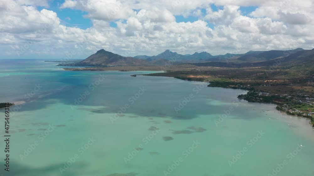 Aerial view sunny day time. Close up fly over palm trees mangrove forest and beautiful beach lagoon. Located in martinique Aerial view sunny day time. Close up fly over palm trees mangrove forest and beautiful beach lagoon. Located in martinique