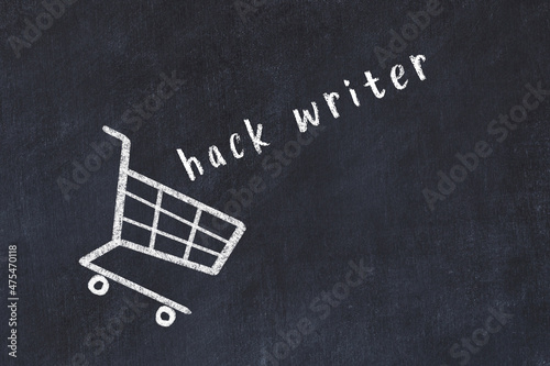 Chalk drawing of shopping cart and word hack writer on black chalboard. Concept of globalization and mass consuming photo