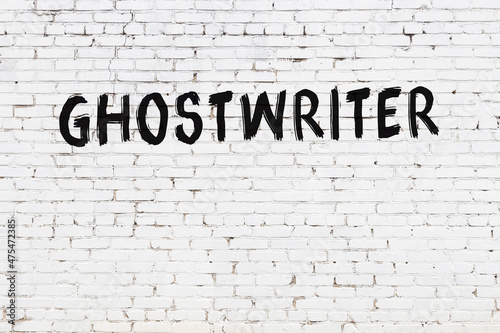 White wall with black paint inscription ghostwriter on it