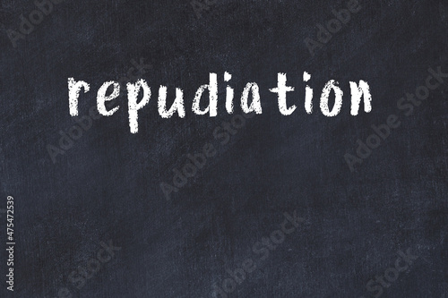 Inscription repudiation painted on white brick wall