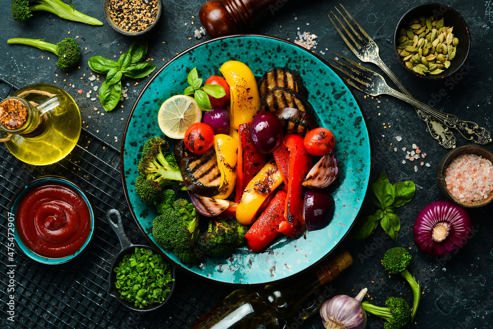 Food background. Barbecue. Grilled vegetables on a blue creative plate. Top view.