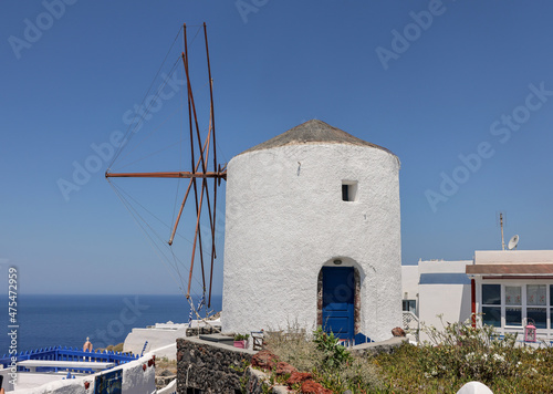 Traditional white windmill in Oia on the island of Santorini. Cyclades, Greece