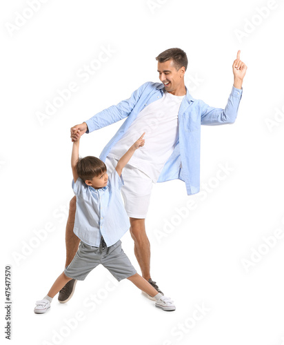 Dancing man and his little son on white background