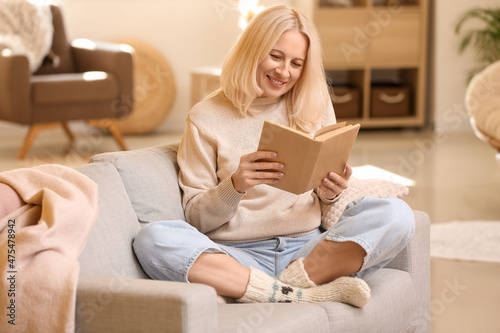 Beautiful mature woman read...