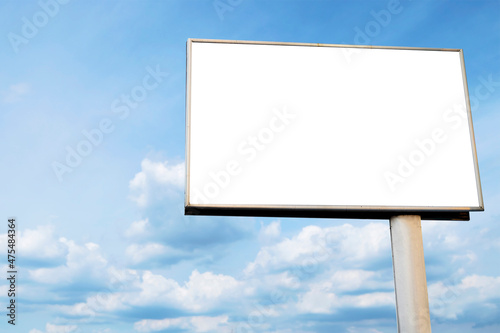 Outdoor billboard on blue sky background.