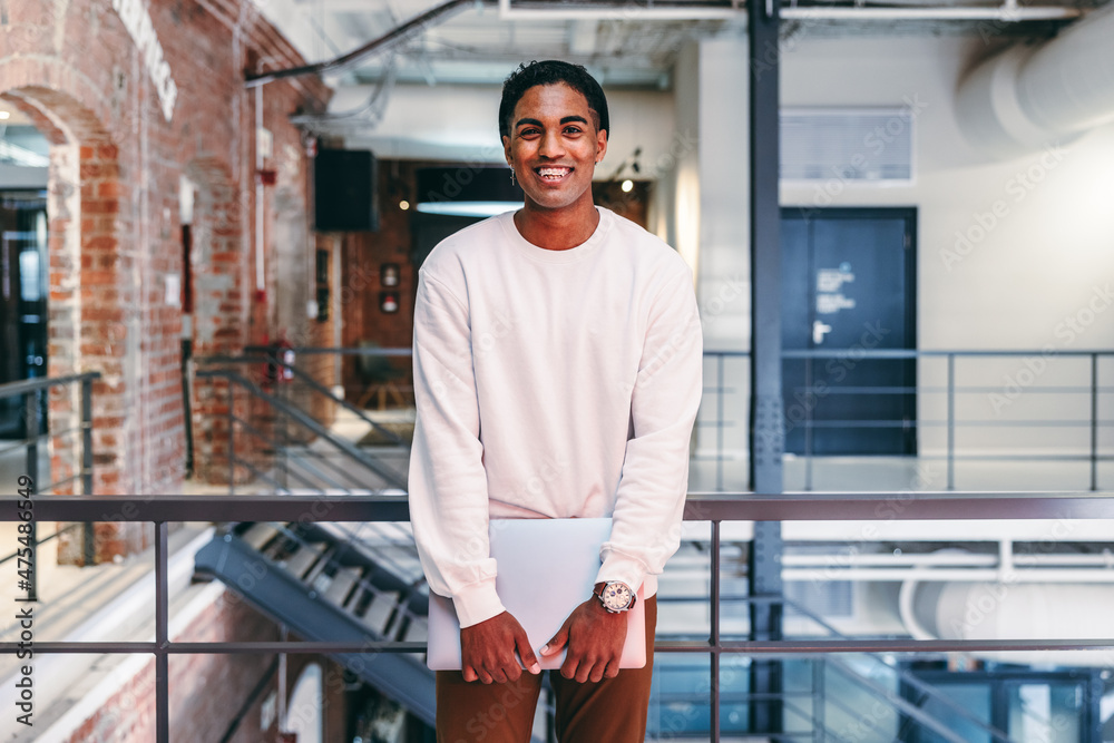 Modern businessman smiling at the camera Modern businessman smiling at the camera
