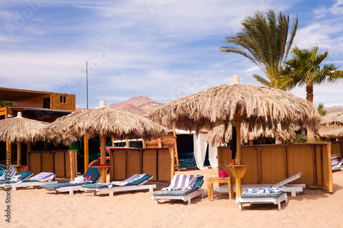 beach umbrella of palm branches against the blue sky  Rest area  Egypt