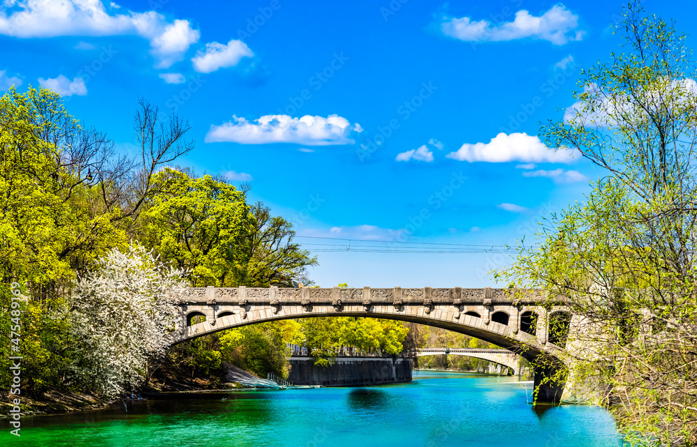 Turquoise Isar river and maximilian bridge in Munich - Germany