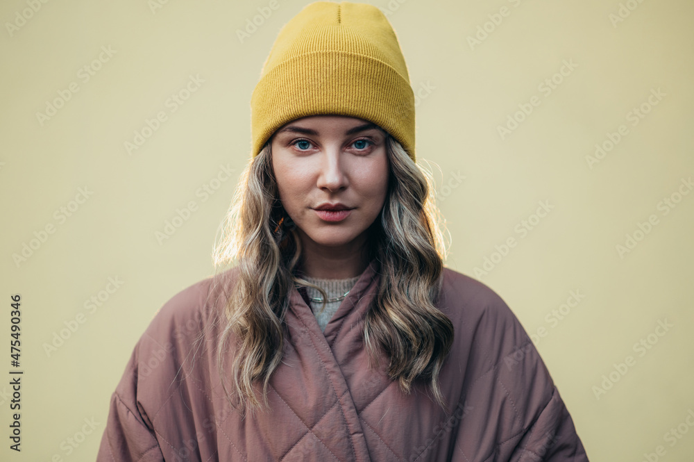 Beautiful young stylish woman wearing coat and a cap Beautiful young stylish woman wearing coat and a cap