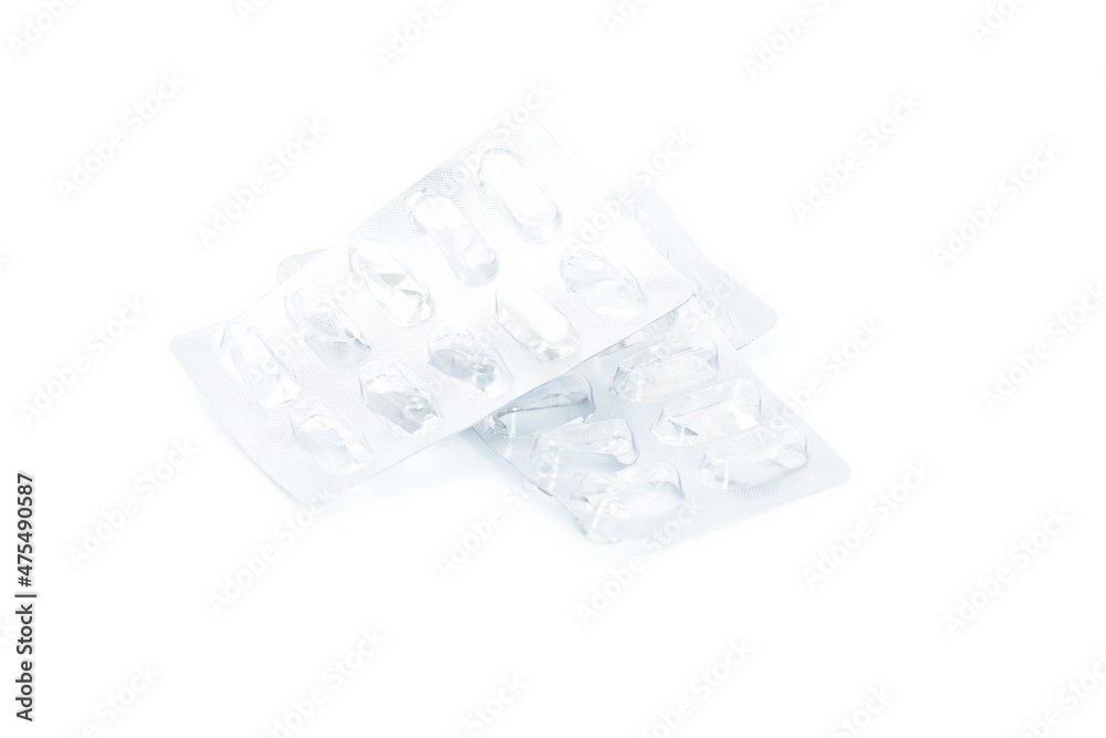 Used packs of pills on wooden background. Close up of open blister. Used packs of pills on wooden background. Close up of open blister.