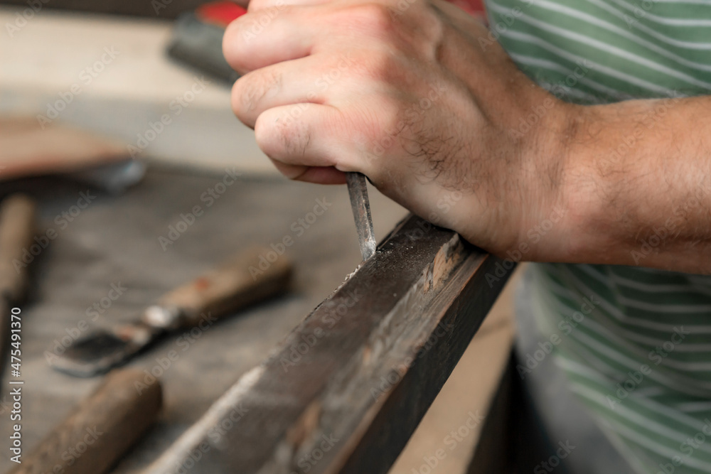 Man assembling furniture and fixing it - hobby garage concept. Man assembling furniture and fixing it - hobby garage concept.