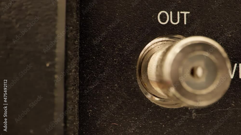 Extreme close up of the back of  a vintage VCR VHF inputs and outputs antennae