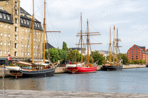 Copenhagen, Denmark - October 1, 2021: old boats along the Larsens PI in Copenhagen harbor