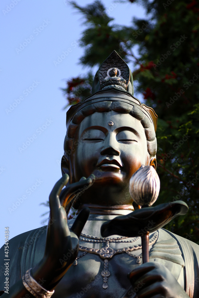 Maitreya statue under the bright blue sky Maitreya statue under the bright blue sky