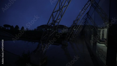 Night shot of the exterior of a modern factory building.
