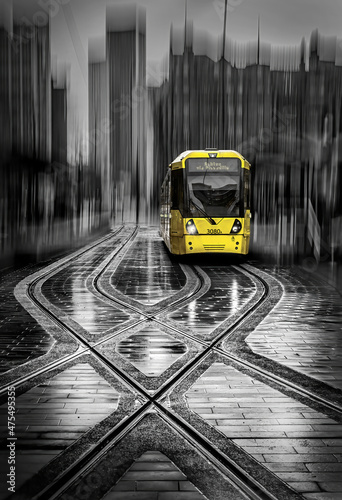 A Yellow Tram at a Stop in Manchester with ICM