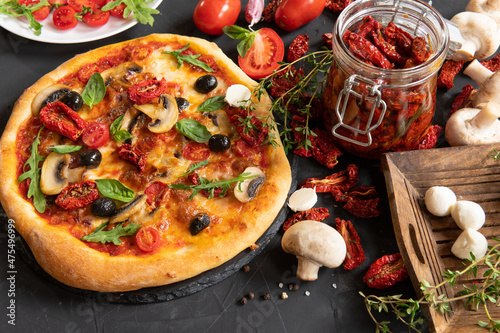 Fresh Homemade Italian Pizza with tomato and basil