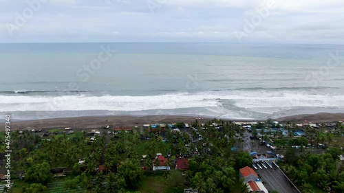 Flying over Suwuk beach in Indonesia, Central Java island. Aerial forward drone view photo