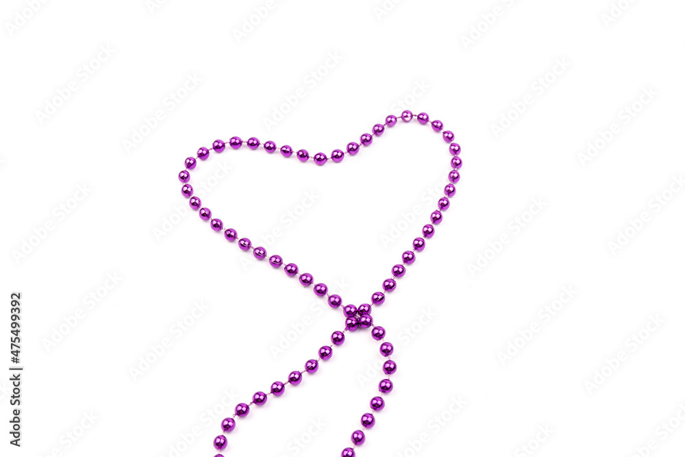 Purple beads a heart shaped on white background. A beautiful chain. Decorative element. Purple beads a heart shaped on white background. A beautiful chain. Decorative element.
