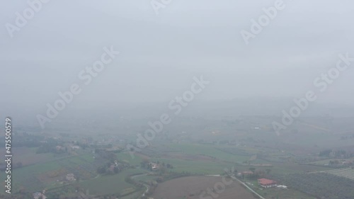 Aerial view of foggy sky and countryside.
Beautiful drone shot.