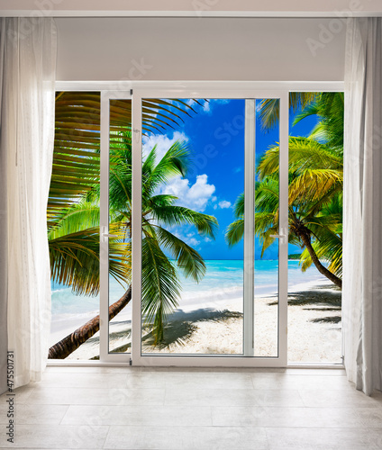 large glass door overlooking the beach