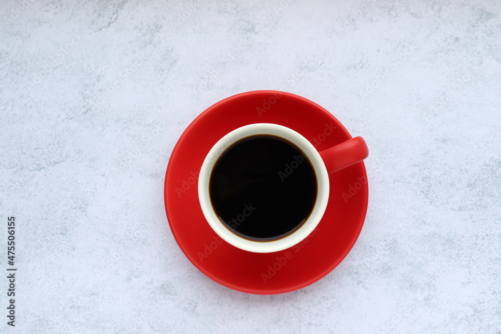 Red cup of black americano, espresso coffee on gray concrete background. Top view, copy space Red cup of black americano, espresso coffee on gray concrete background. Top view, copy space