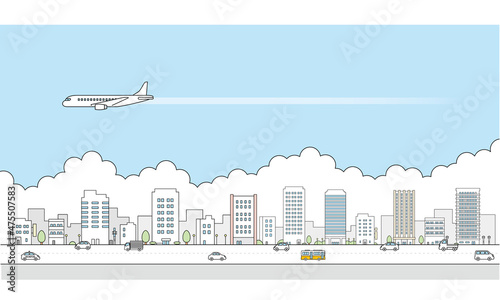 旅客機と街並みのイラスト素材。