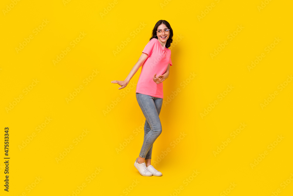 Full size profile side photo of young pretty girl good mood shy look empty space isolated over yellow color background