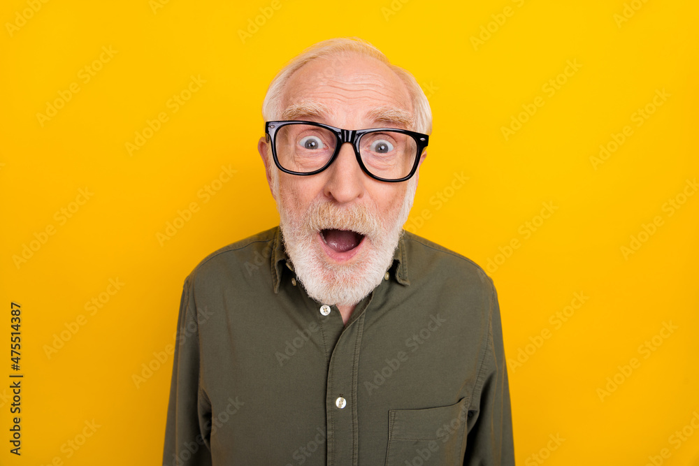 Portrait of impressed aged man open mouth staring camera cant believe isolated on yellow color background - obrazy, fototapety, plakaty 