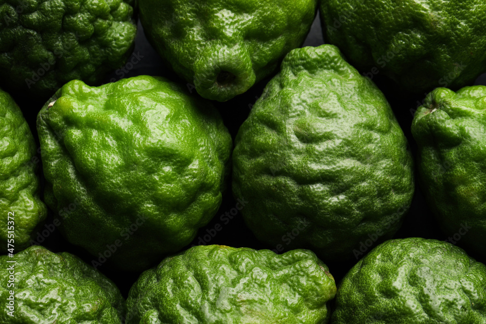 Obraz premium Fresh ripe bergamot fruits as background, top view