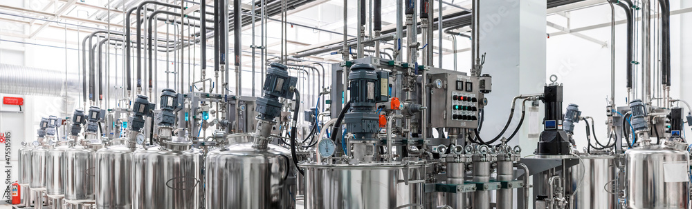 Panoramic photo of pipes and tanks. Chemistry and medicine production ...