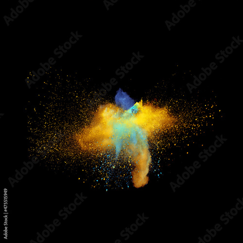 Fototapeta Naklejka Na Ścianę i Meble -  A bizarre form of golden glitter and blue powder paint explode in front of a black background to give off fantastic colors and forms.