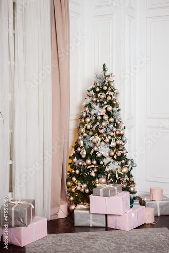 New Year's interior, holiday, Christmas, cozy and warm. Christmas tree and fireplace 