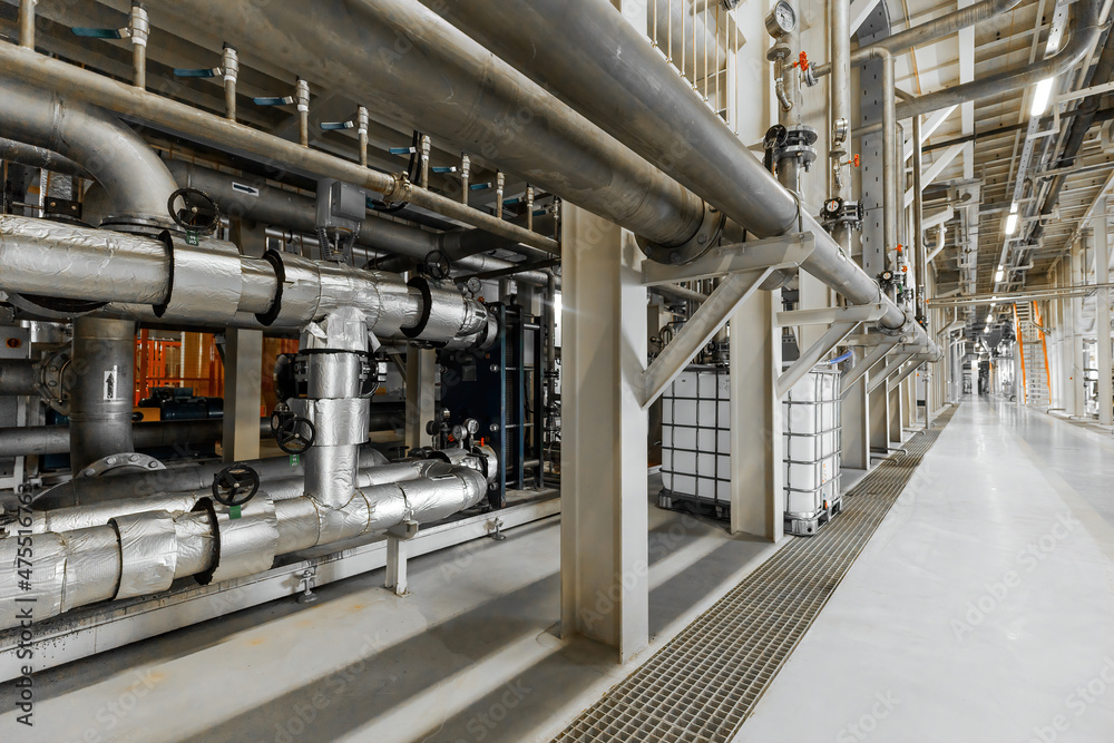 Photo of pipes and tanks. Chemistry and medicine production. Pharmaceutical factory. Interior of a high-tech factory, modern production Photo of pipes and tanks. Chemistry and medicine production. Pharmaceutical factory. Interior of a high-tech factory, modern production